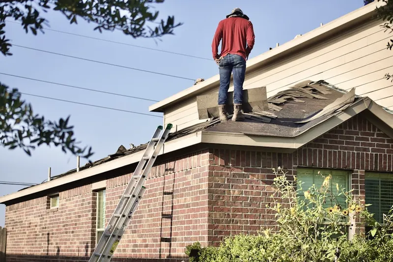 Professional roofer working on a residential roof in Sharpsburg